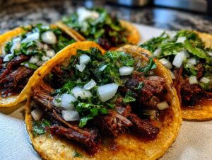 Close-up of several delicious Carne asada street tacos topped generously with chopped white onion and fresh cilantro.